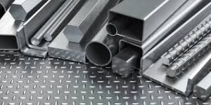 “Various types of steel products including pipes, rods, bars, sheets, angles, and channels displayed on a checkered stainless steel pipe, plate surface.”